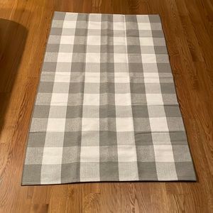 Grey and white checkered rug